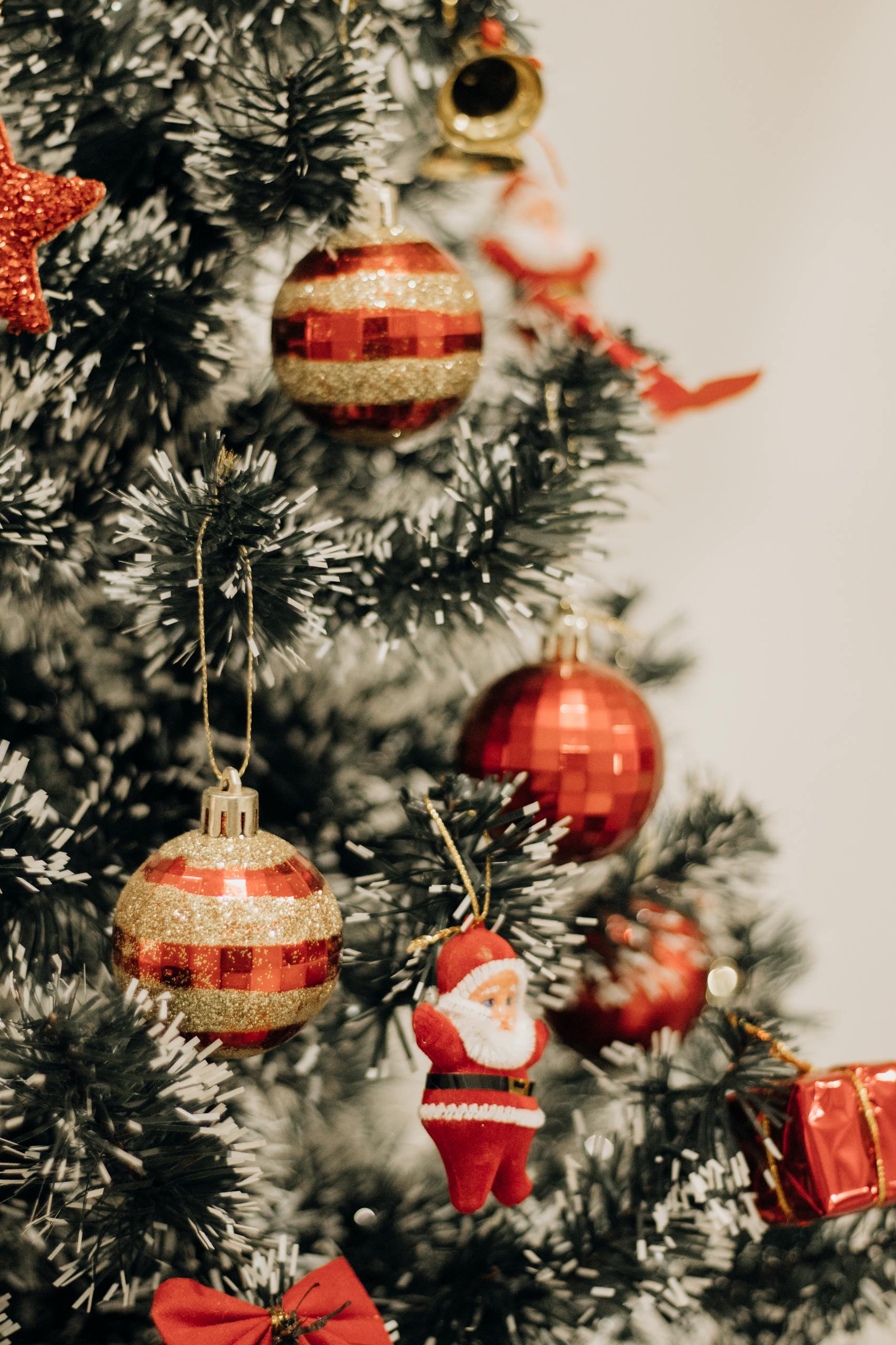 Close-up of a decorated Christmas tree with red ornaments in São Paulo, Brazil.